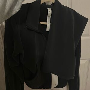 Lululemon outfit brand new skirt size 12, jacket half zip size 14 (worn 2x)